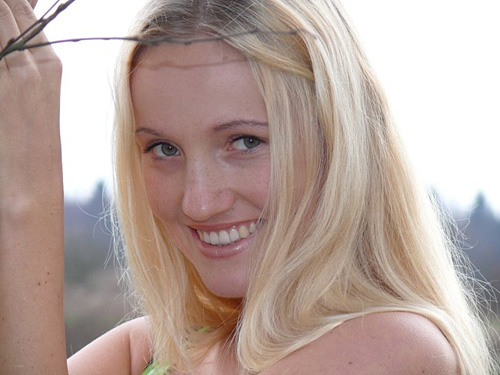 Closeup of hot blonde girl smiling